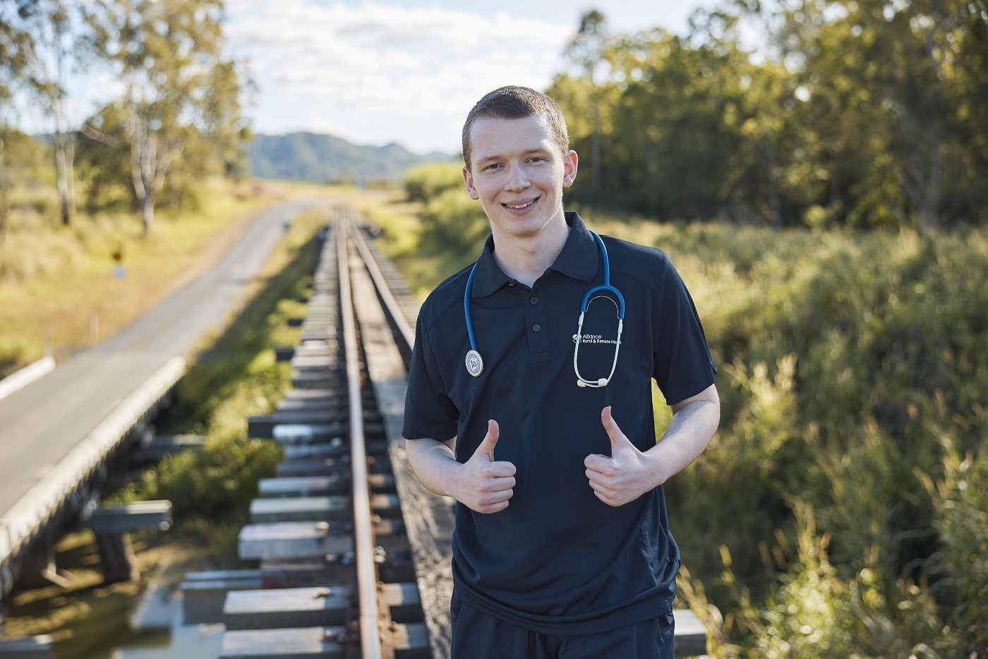 Male nurse on train tracks