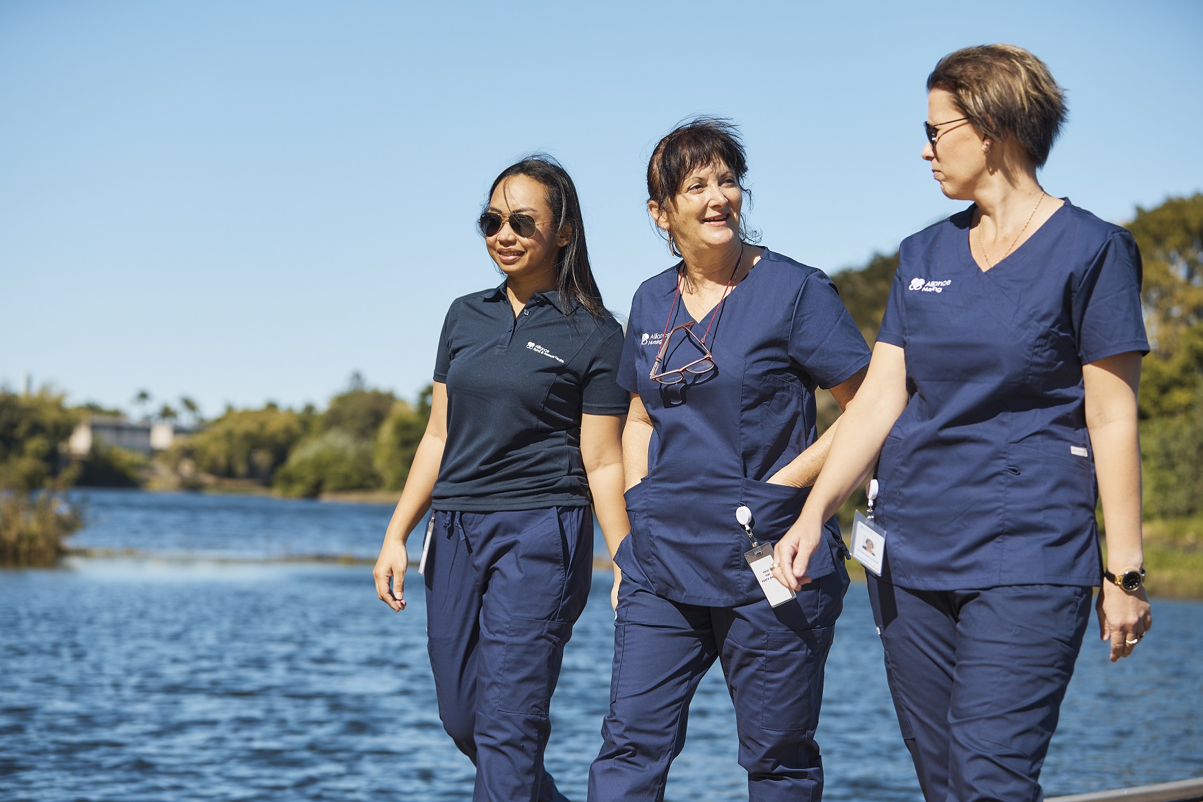 nurses walking by water